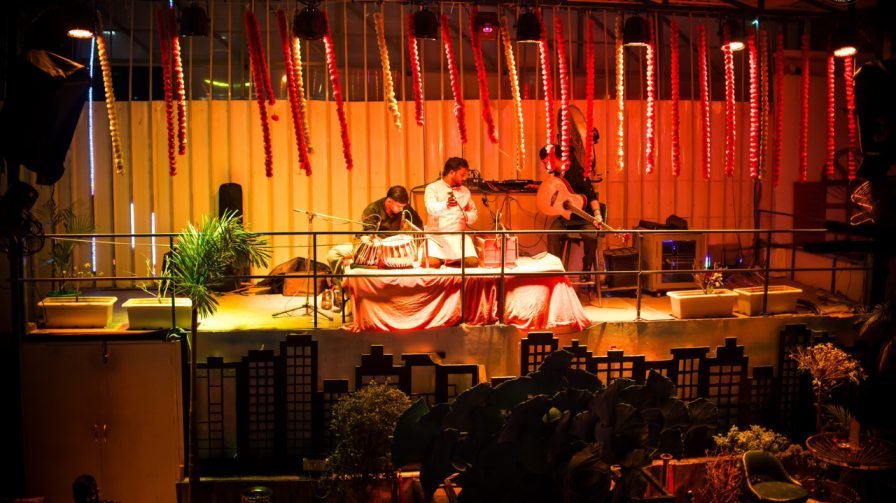 Stylish rooftop bar seating at Ministry of Daru with illuminated MOD sign